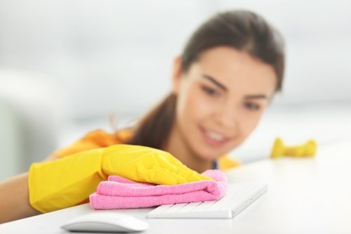 Professional carpet cleaner preparing equipment for a booked service
