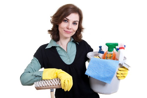 A cleaner carrying out kitchen and bathroom cleaning in SW2